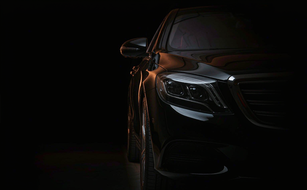 OEM-fit headlight with smoked lens cover installed on a vehicle